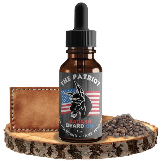 Badass Beard Care The Patriot beard oil bottle with label, featuring natural ingredients and a rugged design for beard grooming.