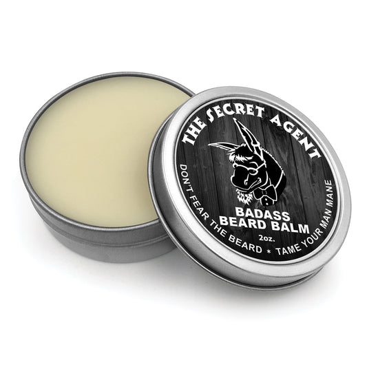 Badass Beard Care Secret Agent beard balm jar with black lid and label, showcasing grooming product for facial hair styling
